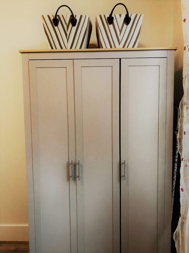 Bedroom wardrobe and storage at King Street Holiday Apartment, Inverness