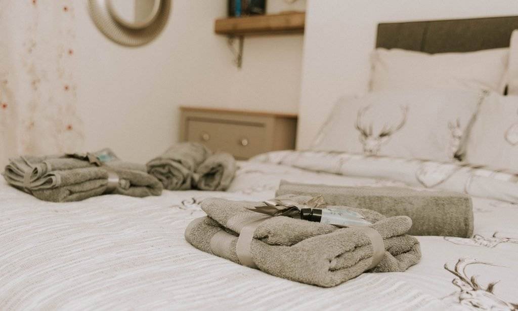 Bed linen and towel detail at King Street Holiday Apartment, Inverness